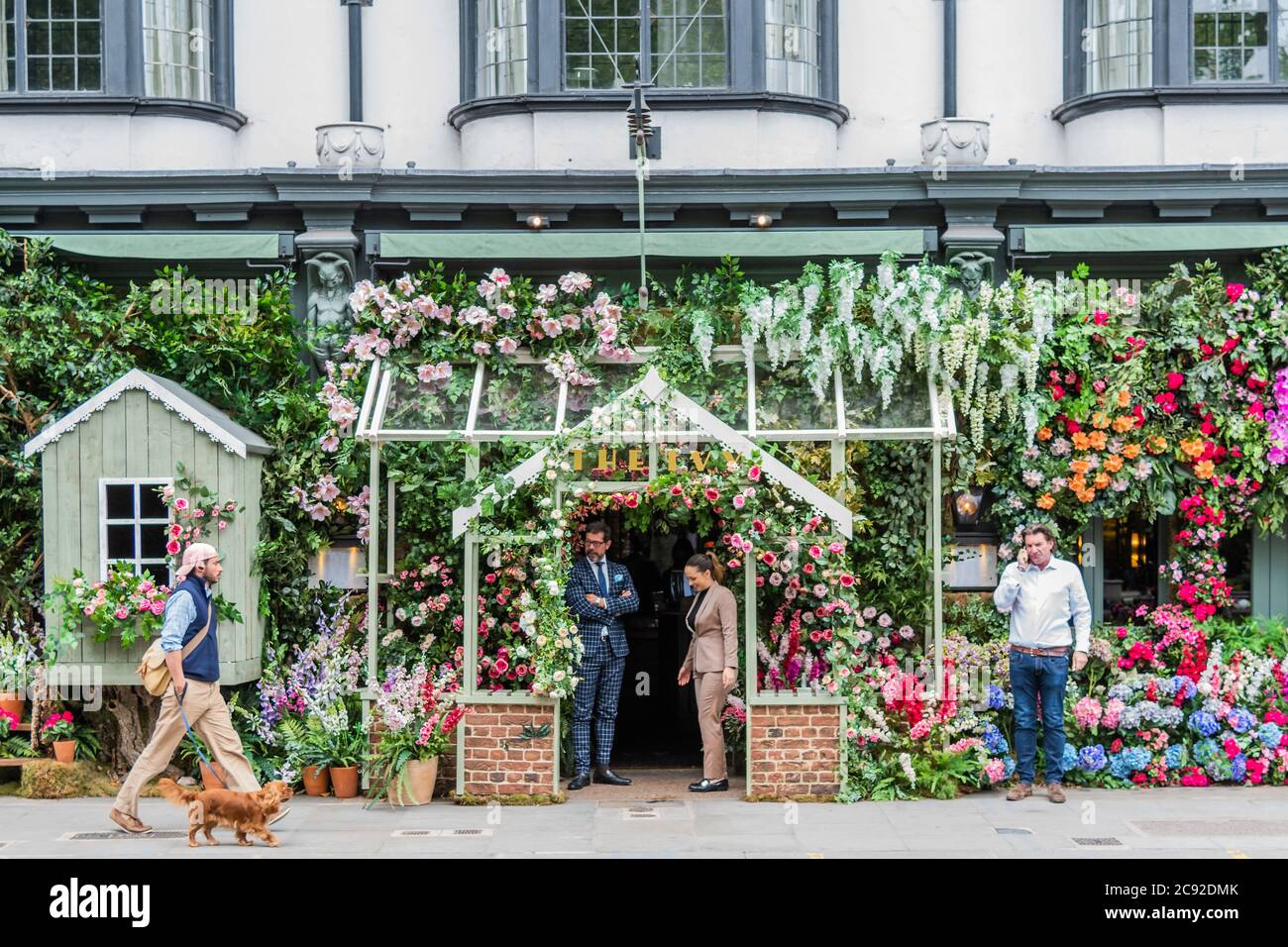London, UK. 28th July, 2020. A trademark floral display to entertain passers-by and clients - The Ivy Chelsea Garden restaurant has reopened as the next stage of the easing of the Coronavirus Lockdown continues. Credit: Guy Bell/Alamy Live News Stock Photo