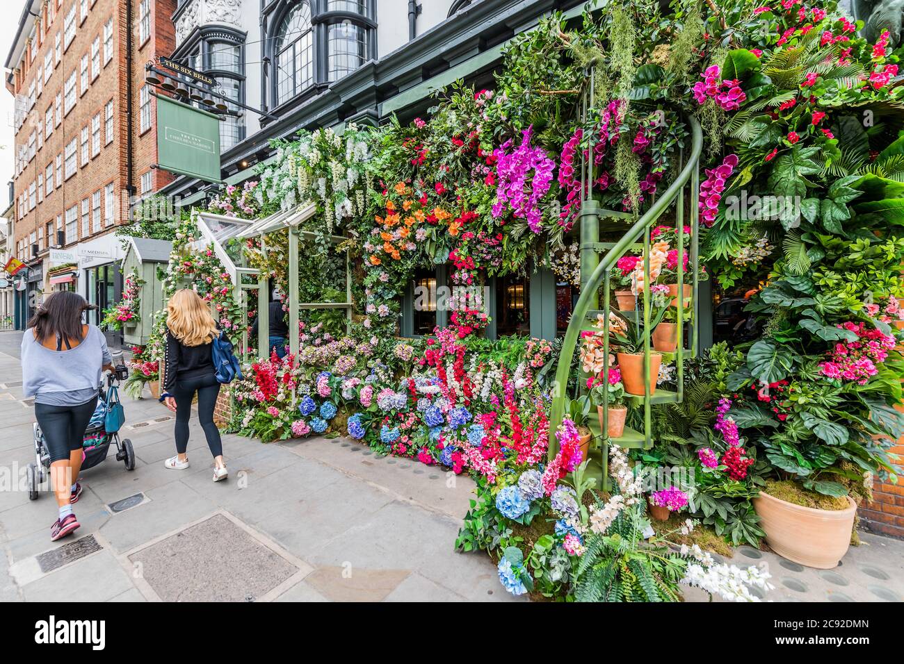 London, UK. 28th July, 2020. A trademark floral display to entertain passers-by and clients - The Ivy Chelsea Garden restaurant has reopened as the next stage of the easing of the Coronavirus Lockdown continues. Credit: Guy Bell/Alamy Live News Stock Photo