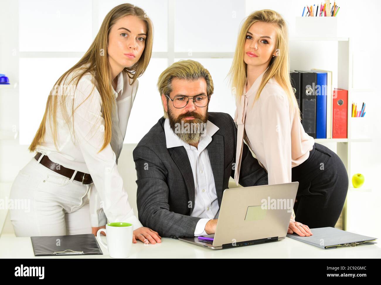 They love their boss. Office flirt. Career company. Flirting and seduction.  Secretary and manager. Office affair. Surrounded by beautiful ladies.  Flirting with boss. Man and women business colleagues Stock Photo - Alamy