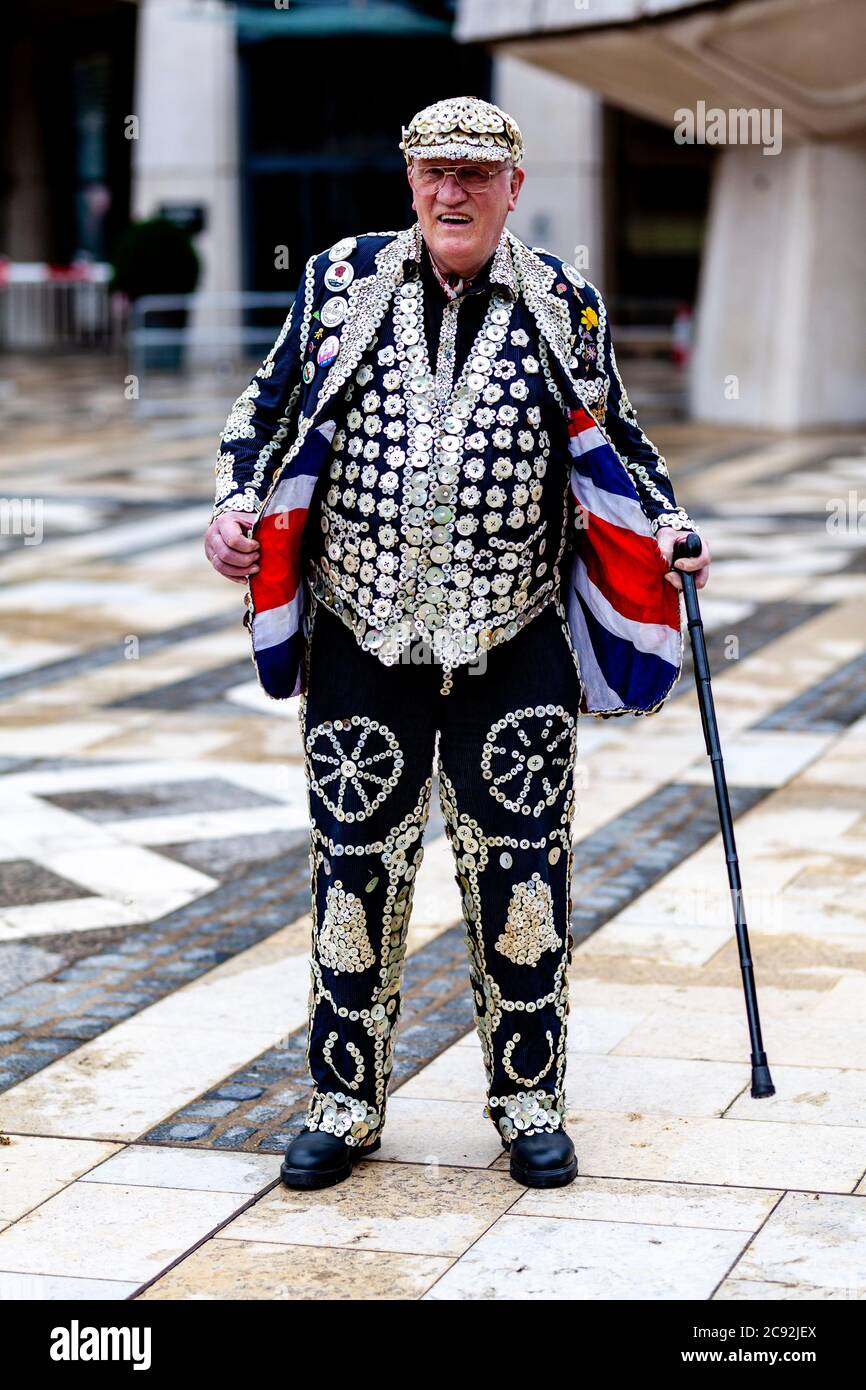 A Pearly King In Traditional Costume At The Pearly Kings and Queens Annual Harvest Festival Held At The Guildhall Yard, London, England. Stock Photo