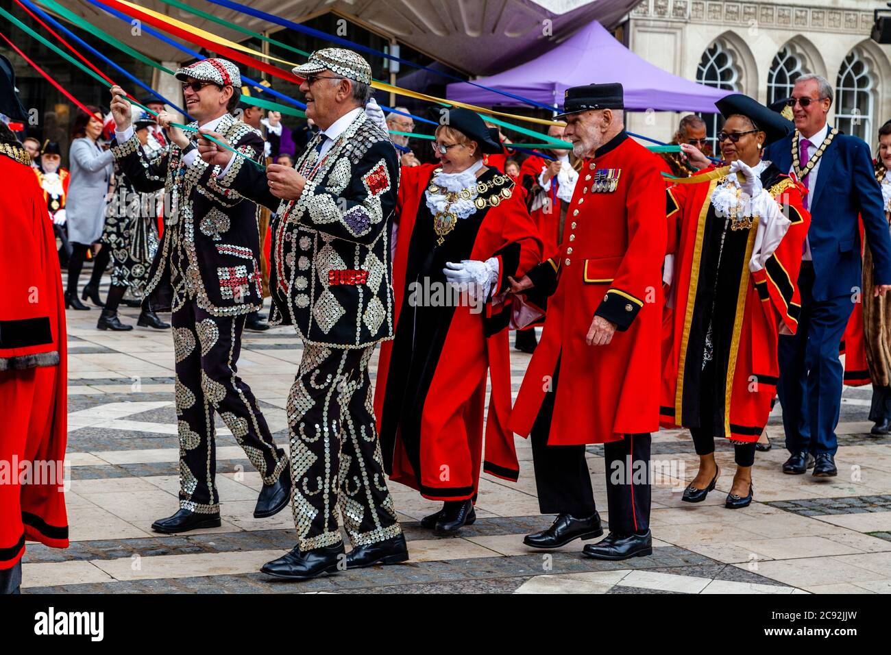 Pearly Kings and Queens and London Mayors Take Part In A Traditional Maypole Dance At The Pearly Kings and Queens Annual Harvest Festival, London, UK Stock Photo