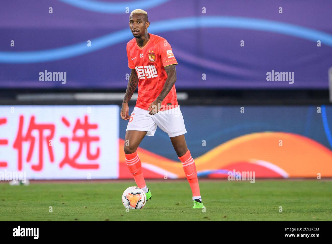 Brazilian Football Player Anderson Souza Conceicao Known As Anderson Talisca Or Simply Talisca Of Guangzhou Evergrande Taobao F C Keeps The Ball During The First Round Match After Chinese Football Association Super League Csl