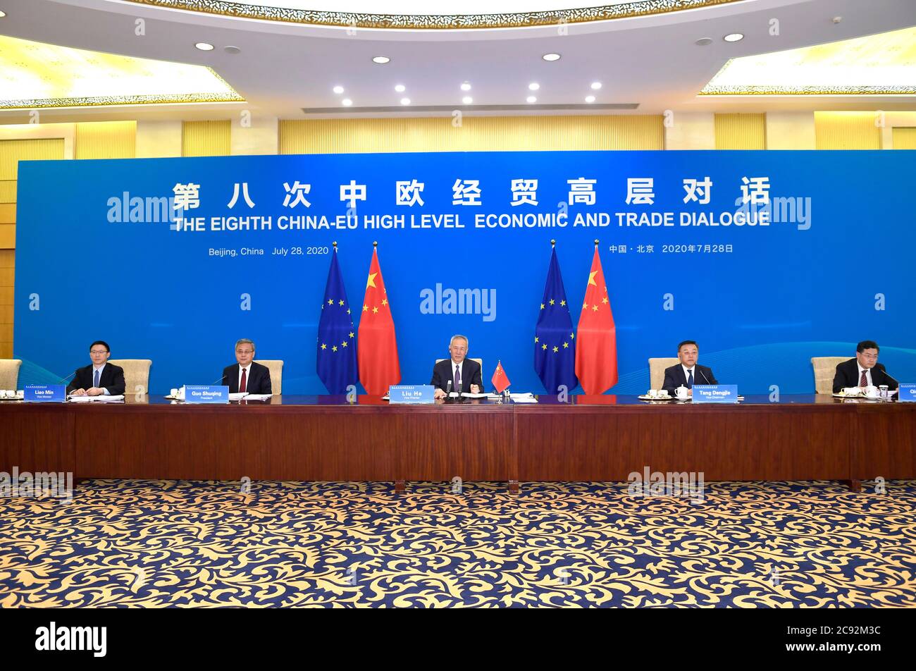 Beijing, European Commission. 28th July, 2020. Chinese Vice Premier Liu He, also a member of the Political Bureau of the Communist Party of China Central Committee, co-chairs the 8th China-EU High-level Economic and Trade Dialogue with Valdis Dombrovskis, executive vice president of the European Commission, via video link on July 28, 2020. Credit: Yue Yuewei/Xinhua/Alamy Live News Stock Photo