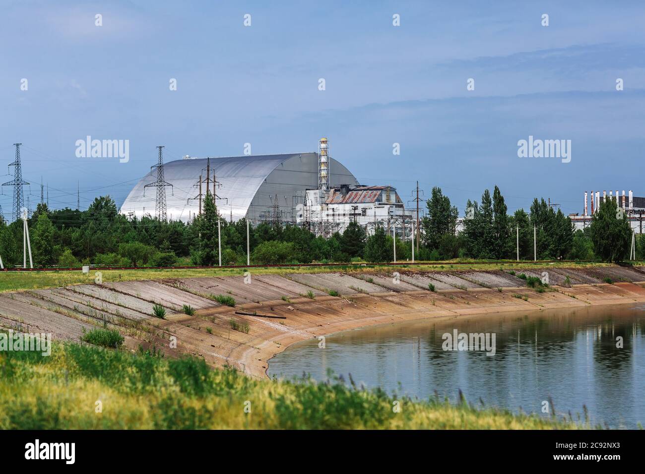 Nuclear reactor of Chernobyl power plant next to Pripyat river 4th reactor with sarcophagus Exclusion Chernobyl zone Ukraine Eastern Europe Stock Photo