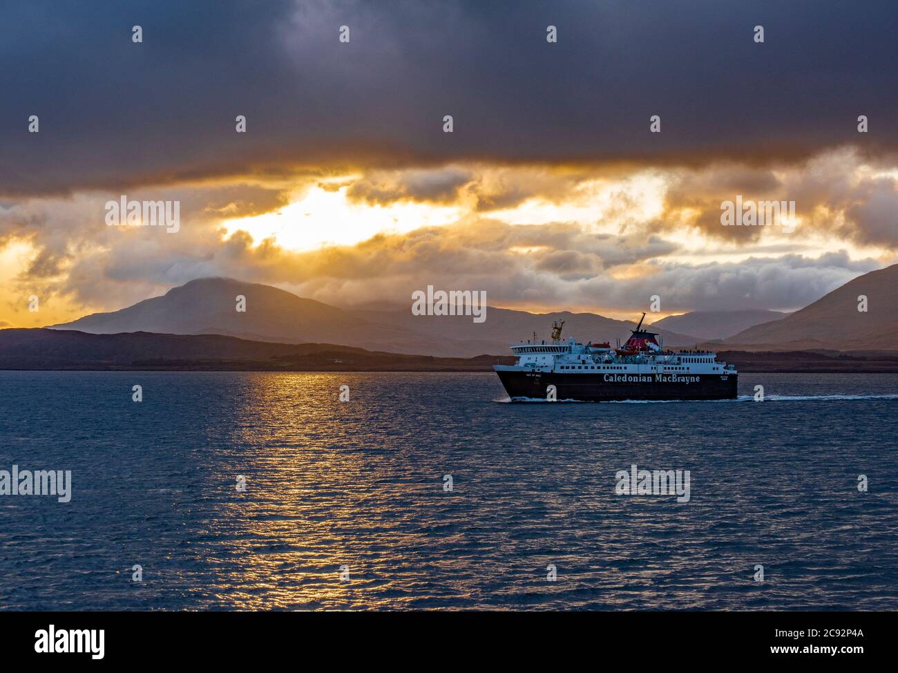 Caledonian MacBrayne ferry on the Sound of Mull. Storm clouds and showers on the Isle of Mull, Scottish Inner Hebrides near Oban, Argyll and Bute. Stock Photo