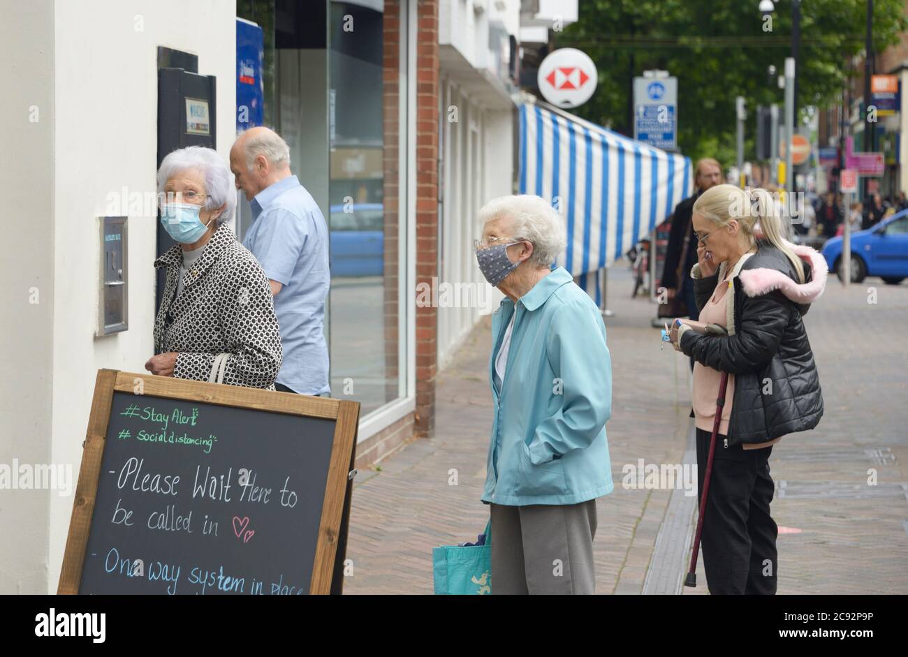 Old ladies queueing to enter the Bank, post lockdown. Stock Photo