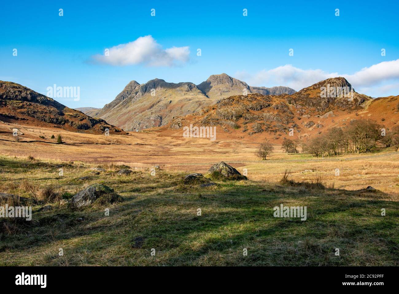 Langdale, Cumbria, The Lake District with Langdale Fell and Langdale Pikes in the distance. Stock Photo