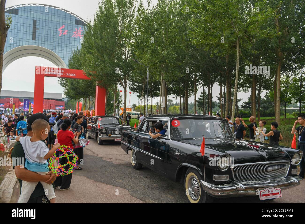 Changchun, China's Jilin Province. 28th July, 2020. A fleet of vehicles start an urban tour during an event showcasing the products and culture of China's iconic auto brand Hongqi in Changchun, northeast China's Jilin Province, July 28, 2020. Credit: Zhang Nan/Xinhua/Alamy Live News Stock Photo