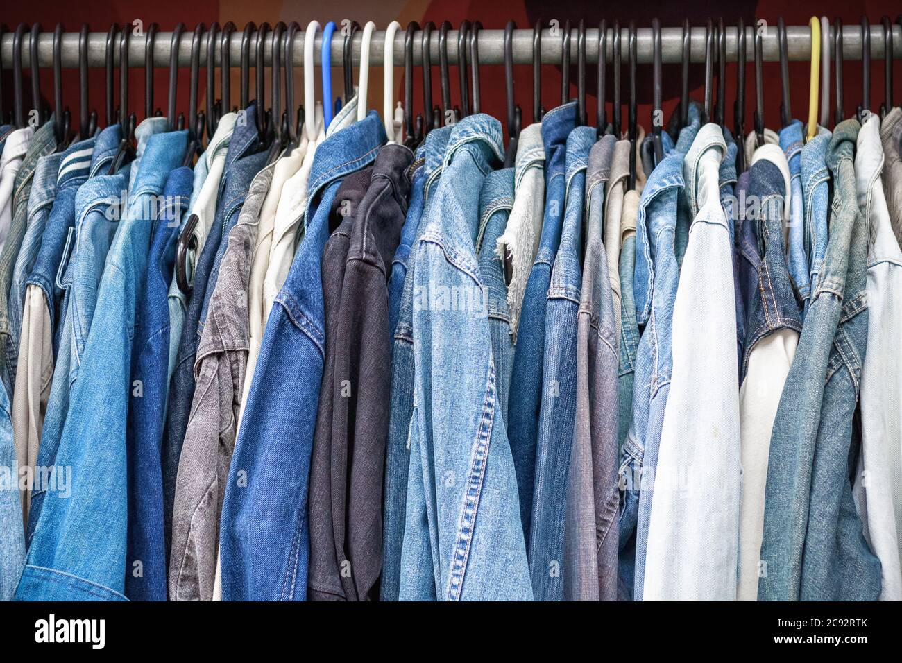 Rack of denim jackets on display at Camden market in London Stock Photo