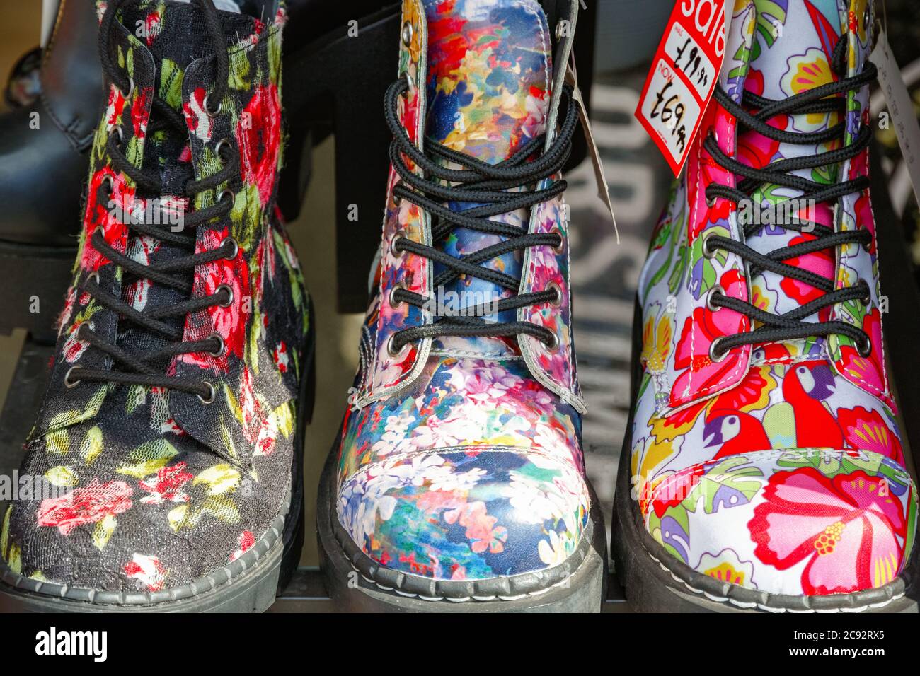 Floral boots on display at Camden market in London Stock Photo