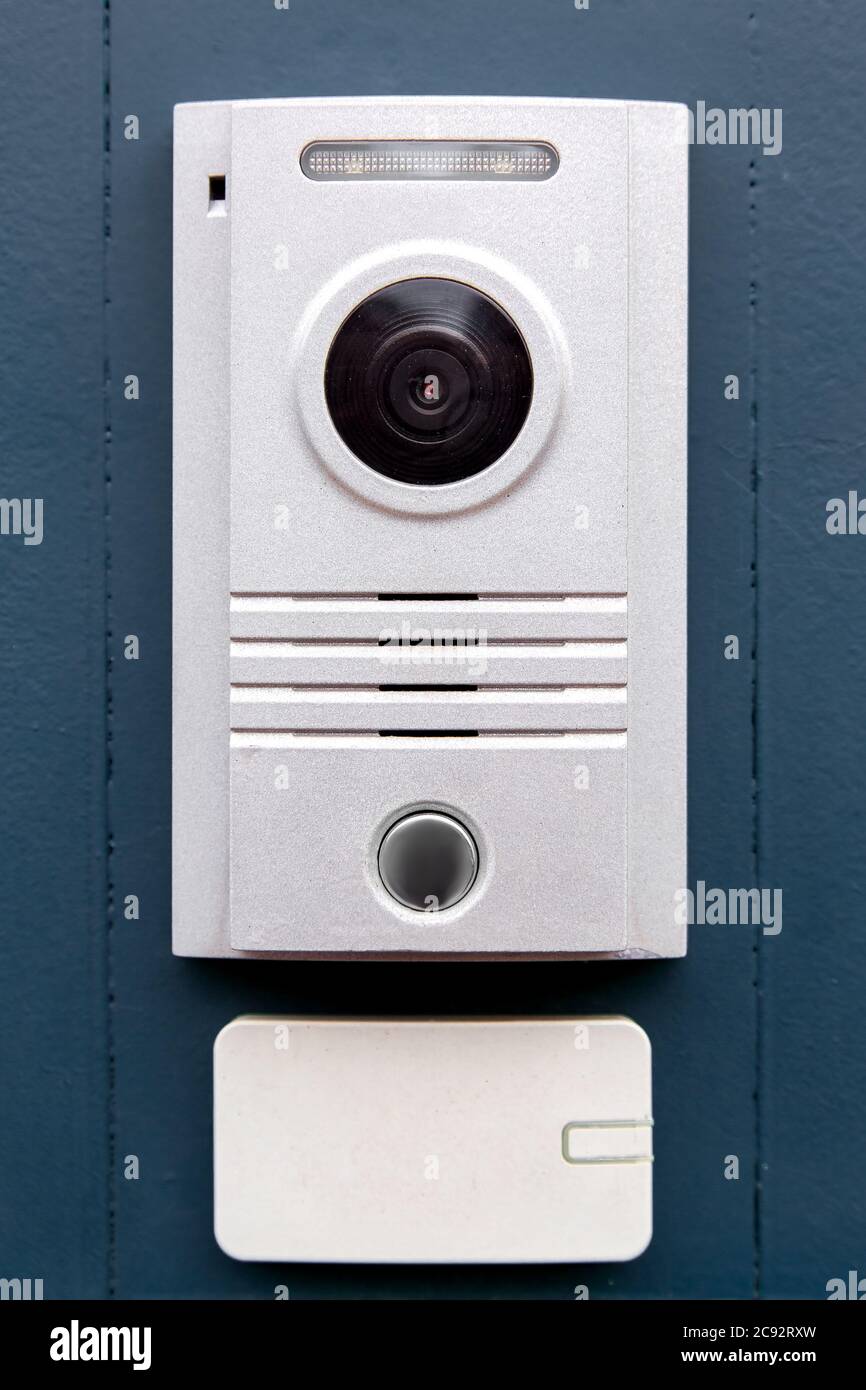 An with a call button and a light colored camera is installed