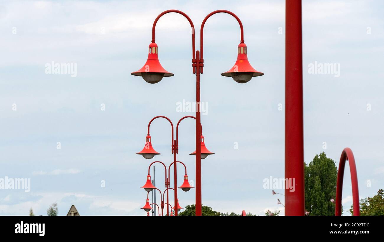 Red colored street lamps from a frog's eye perspective Stock Photo