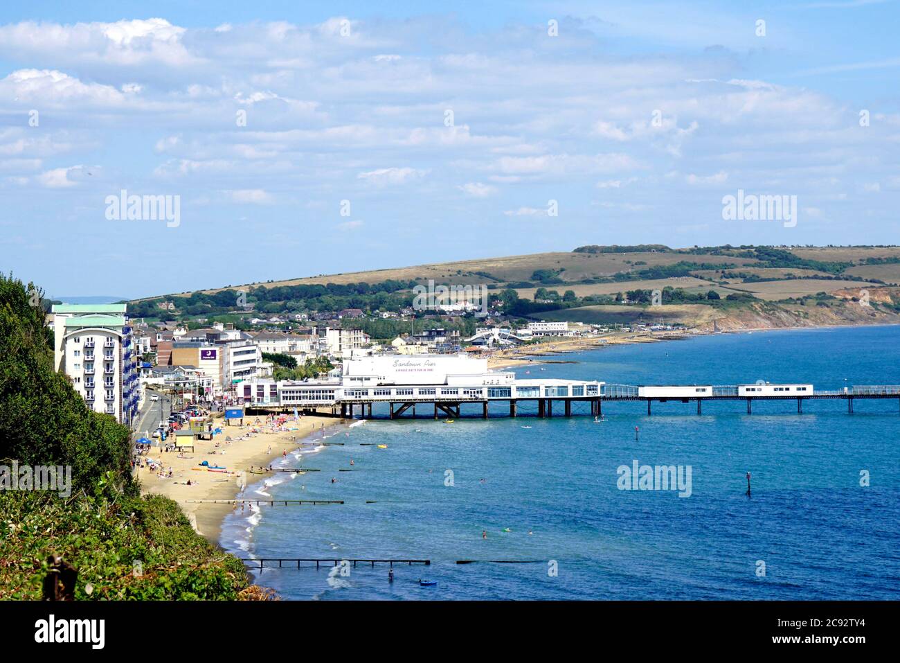 Sandown, Isle of Wight, UK. July 20, 2020. Holidaymakers enjoying the beach and pier in the Summer sunshine taken from the cliff path at Sandown on th Stock Photo