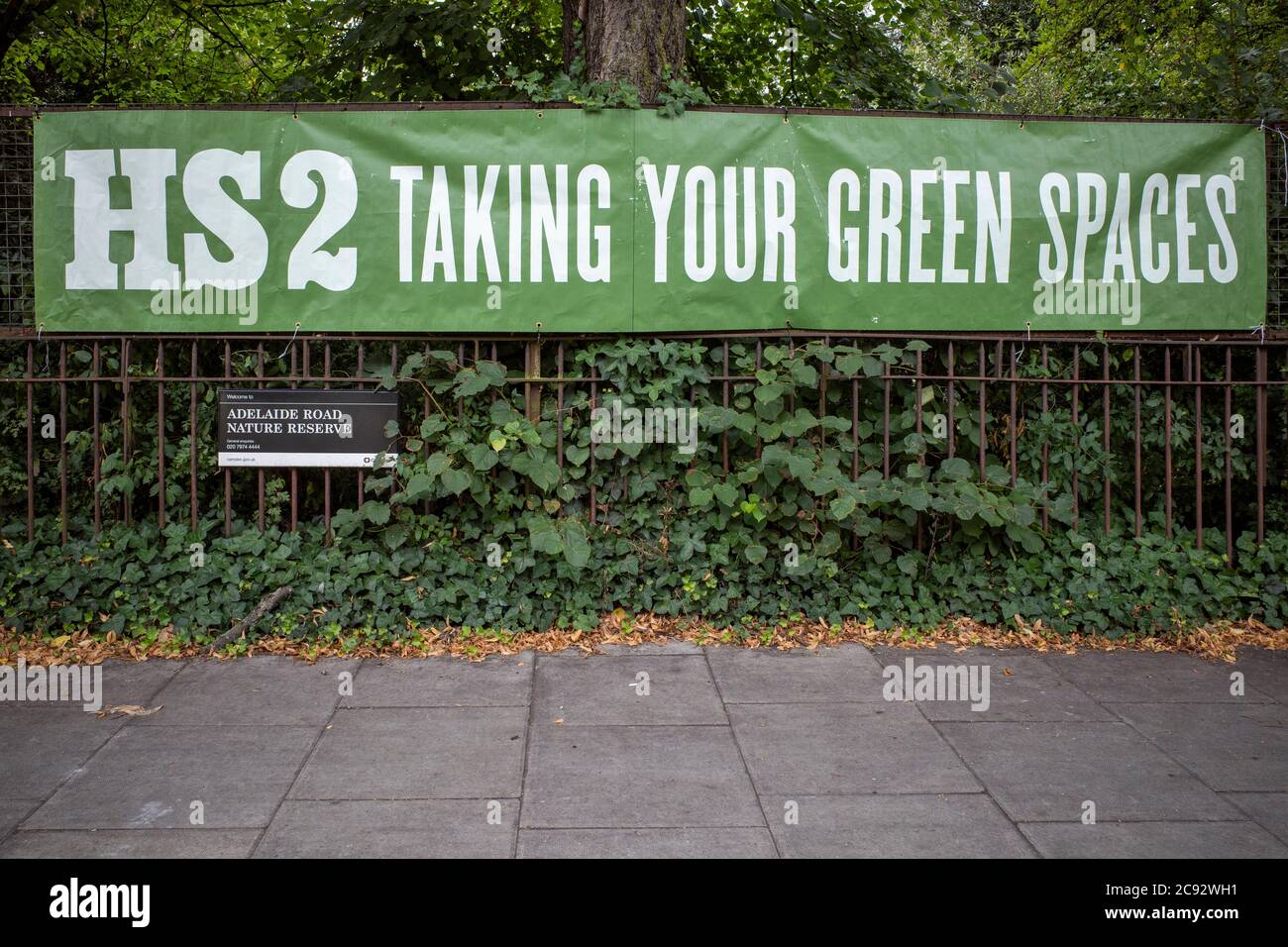 Banner on a local nature reserve in Camden Town objecting to HS2 (High Speed 2) and the controversial impact on wildlife habitat. Stock Photo