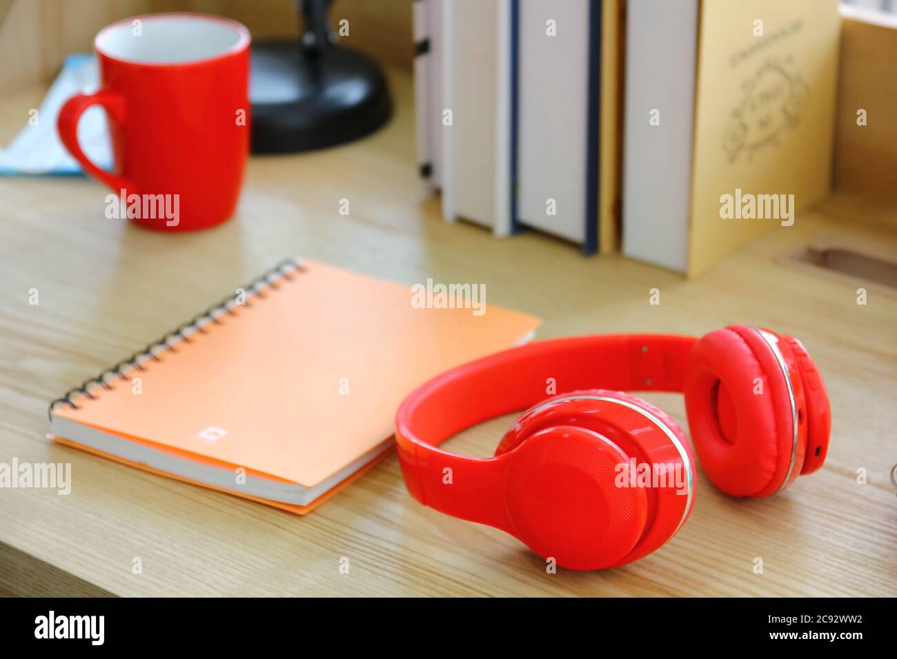 red head phone on table after used  work at home Stock Photo