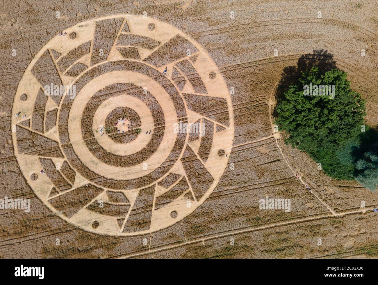 28 July 2020, Bavaria, Pähl: Interested people wander through a crop circle in a field near Pähl. Photo: Sven Hoppe/dpa Stock Photo