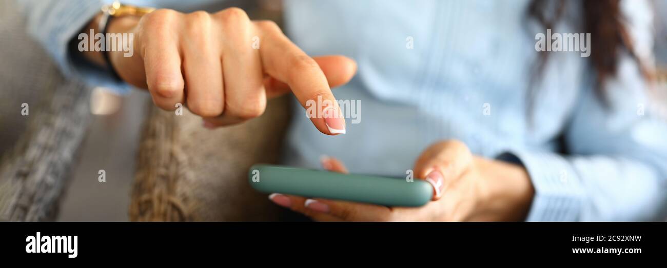 Lady holding mobile Stock Photo