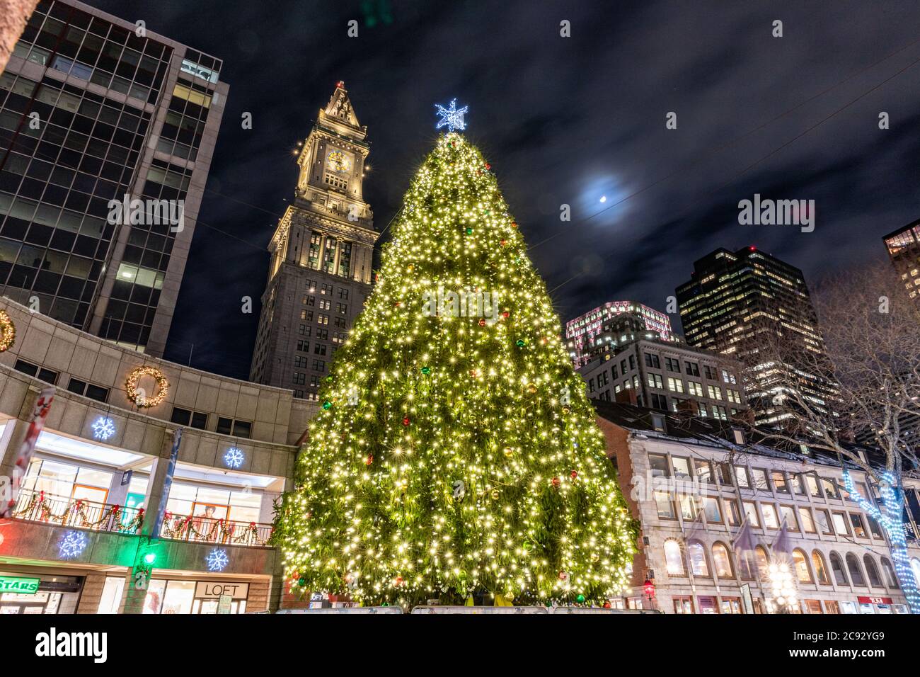 Boston christmas tree and city buildings at night Stock Photo Alamy