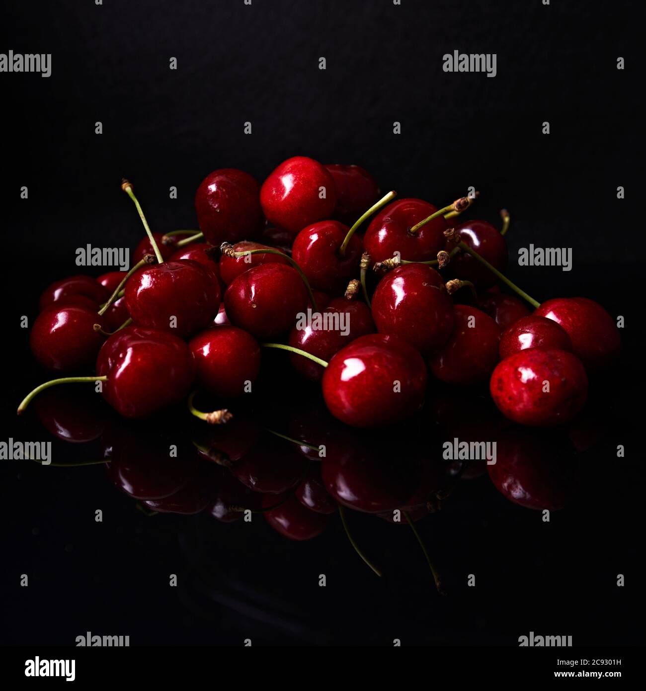 cherry still life on black background Stock Photo