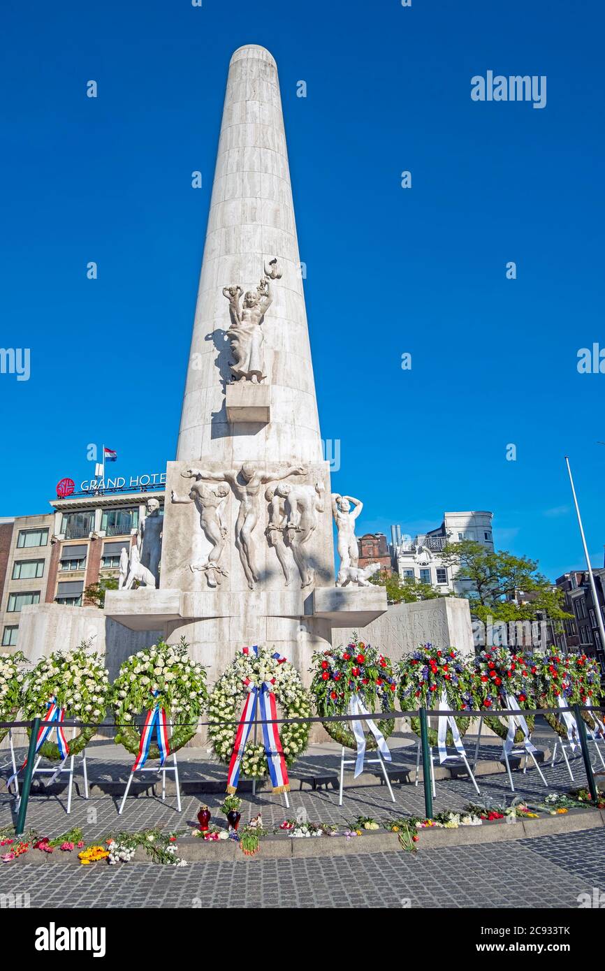 Amsterdam, Netherlands - May 5, 2020: Wreaths at the National Monument on the occasion of remembrance of the worldwar II in Amsterdam the Netherlands Stock Photo