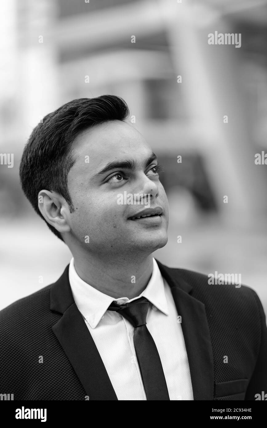 Handsome indian man in black Black and White Stock Photos & Images - Alamy