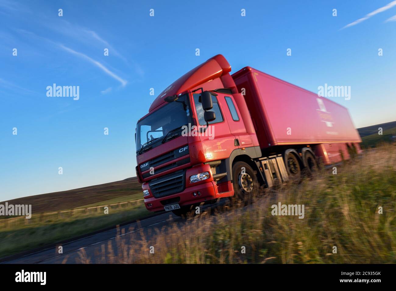 Royal Mail DAF CF truck driving along the A628 Woodhead Pass, Yorkshire, in late evening Stock Photo