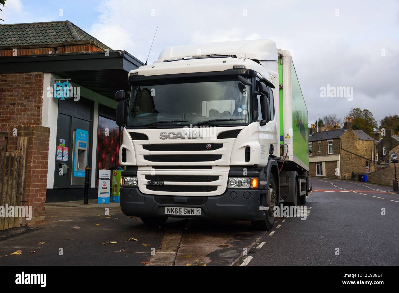 CoOp Food Scania truck pulling a refrigerated trailer making a delivery
