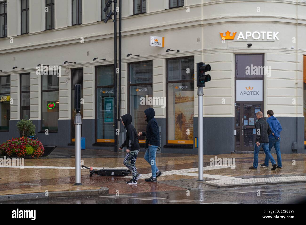 Helsingborg, Sweden - July 26, 2020: A rainy summer day. People run for shelter Stock Photo