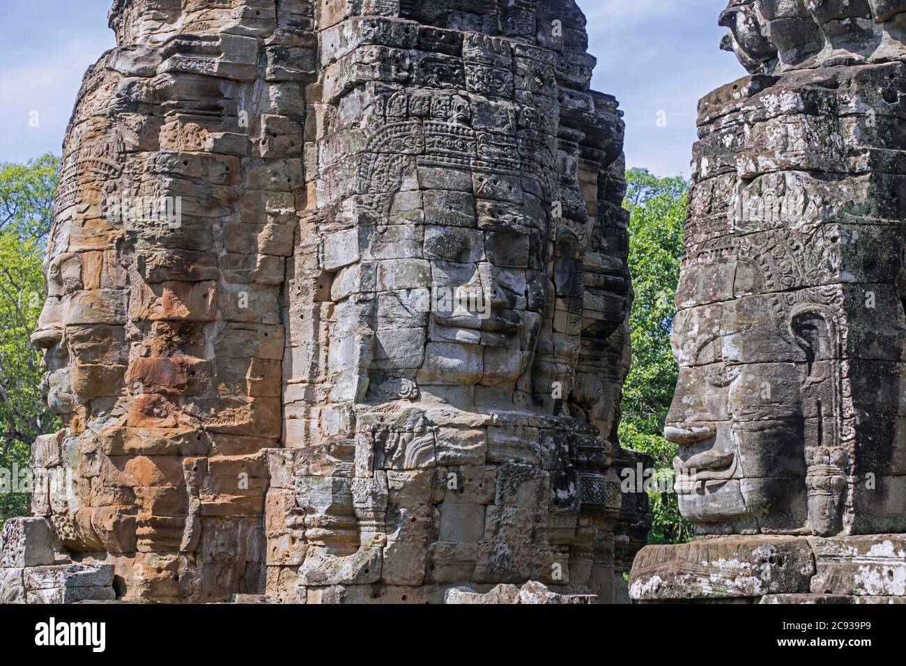 12th century stone faces at Angkor Thom / Nokor Thom, capital city of the Khmer Empire, Siem Reap, Cambodia Stock Photo