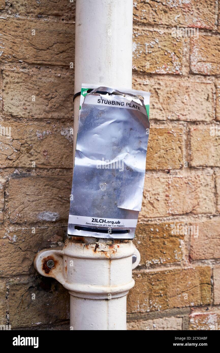 Stubbing plate attached to a drain pipe Stock Photo