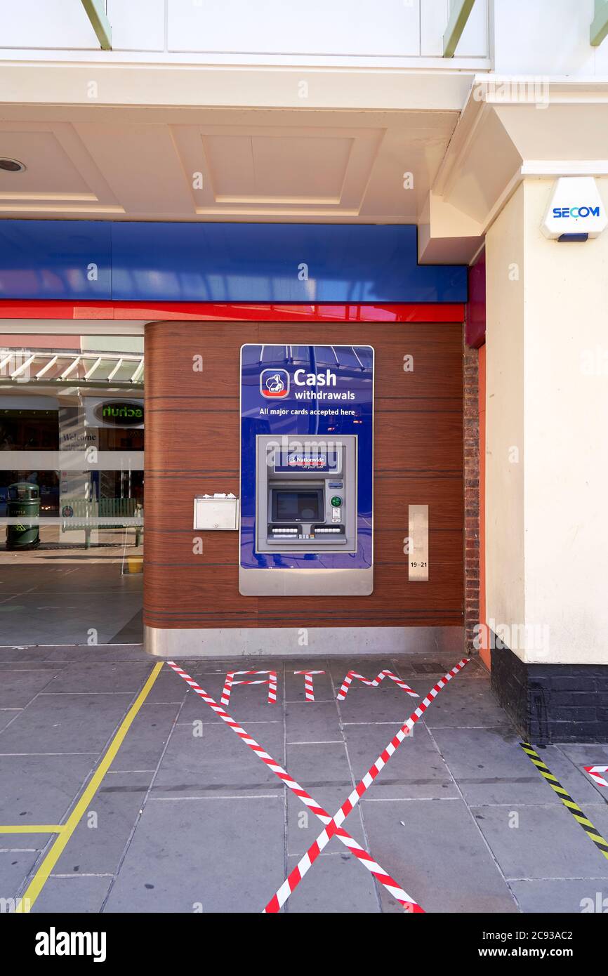 Nationwide building society bank ATM cash machine with social distancing area defined by tape Stock Photo