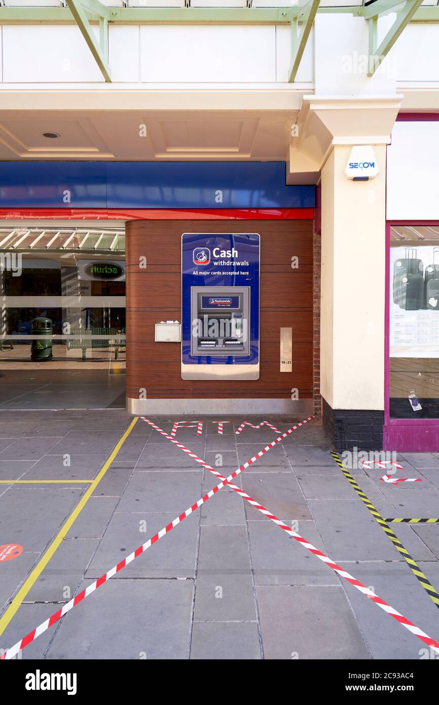 Nationwide building society bank ATM cash machine with social distancing area defined by tape Stock Photo