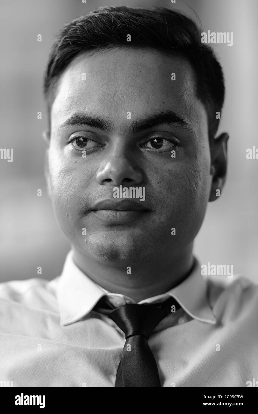 Handsome indian man in black Black and White Stock Photos & Images - Alamy