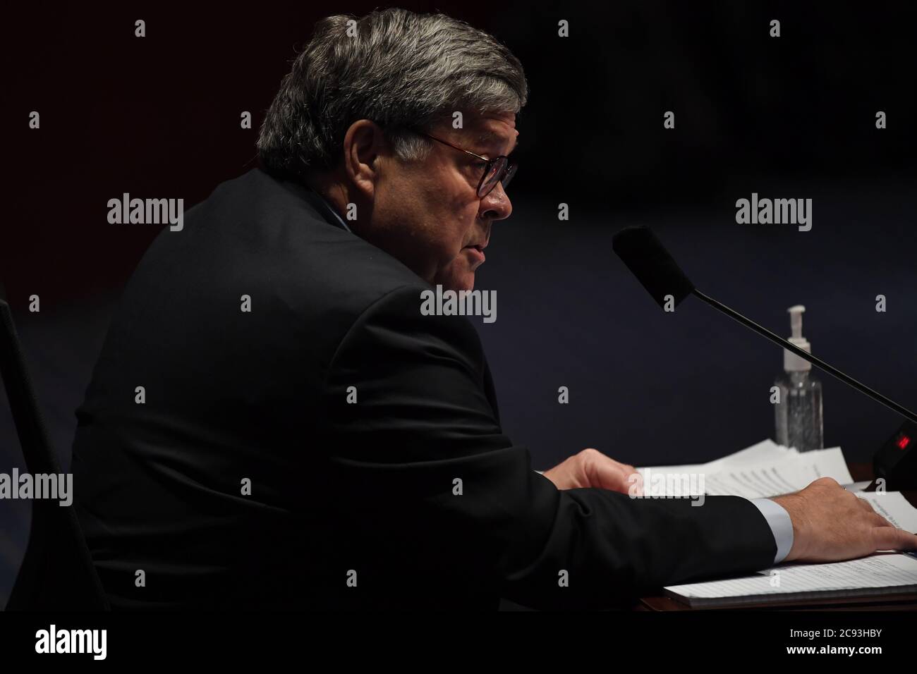 United States Attorney General William P. Barr reads from his opening statement as he gives testimony before the US House Committee on the Judiciary on Capitol Hill in Washington, DC on July 28, 2020. Credit: Matt McClain/Pool via CNP/MediaPunch Stock Photo