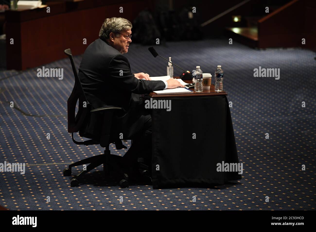 United States Attorney General William P. Barr reads from his opening statement as he gives testimony before the US House Committee on the Judiciary on Capitol Hill in Washington, DC on July 28, 2020. Credit: Matt McClain/Pool via CNP/MediaPunch Stock Photo