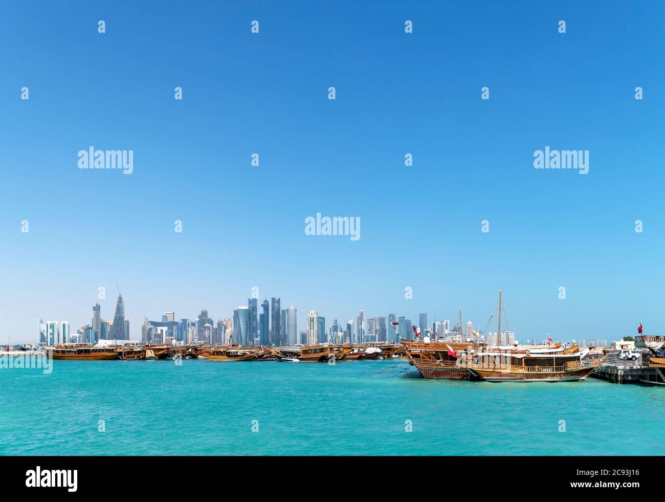 Dhows in the Dhow Harbour with the West Bay Central Business District skyline behind, Doha, Qatar, Middle East Stock Photo