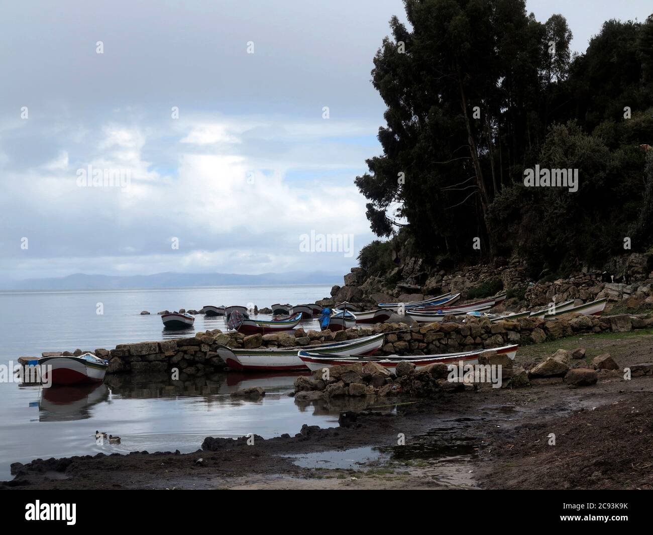 Lake Titicaca, straddling the border between Peru and Bolivia in the Andes Mountains, is one of South America's largest lakes and the world’s highest Stock Photo