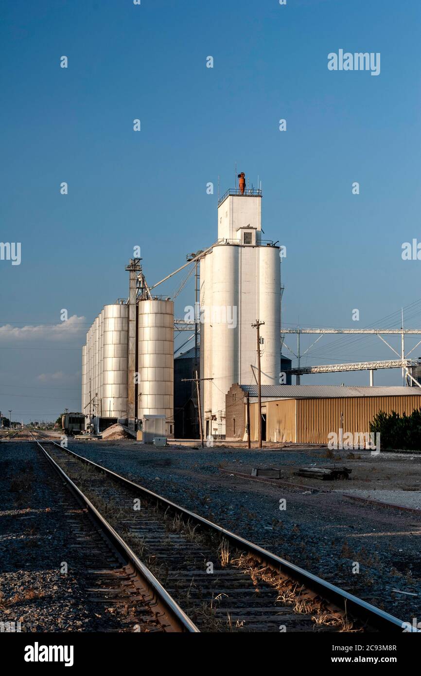 Grain elevators and train tracks, railyard, Portales, New Mexico USA