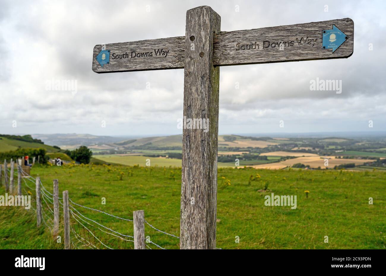 South Downs National Park, Sussex, UK near Firle Beacon. A signpost shows the route of the South Downs Way with views over the Weald. Stock Photo