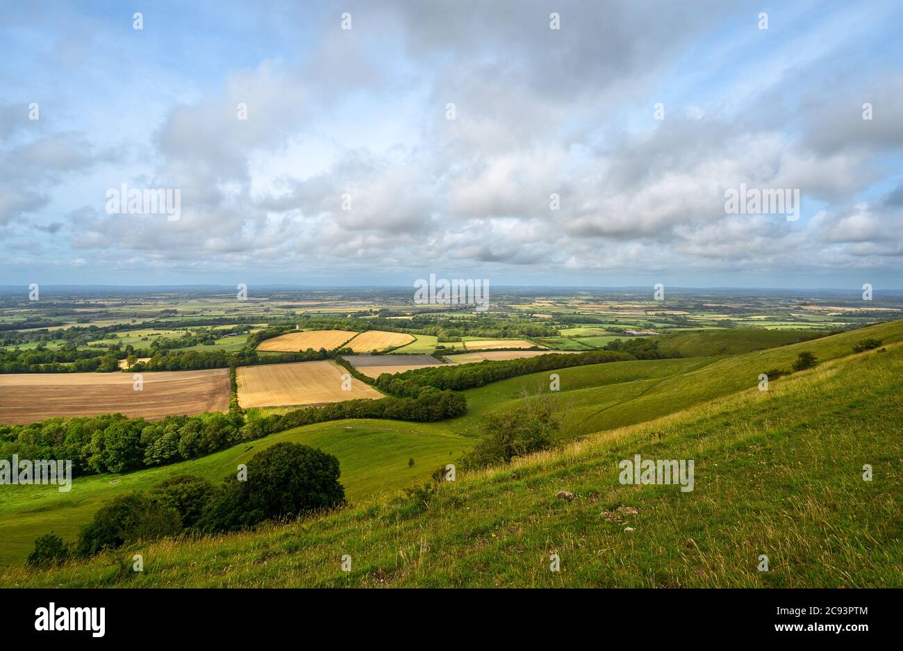 South Downs National Park, Sussex, UK near Firle Beacon. Views over the Weald with sunshine and clouds seen from the South Downs Way. Stock Photo
