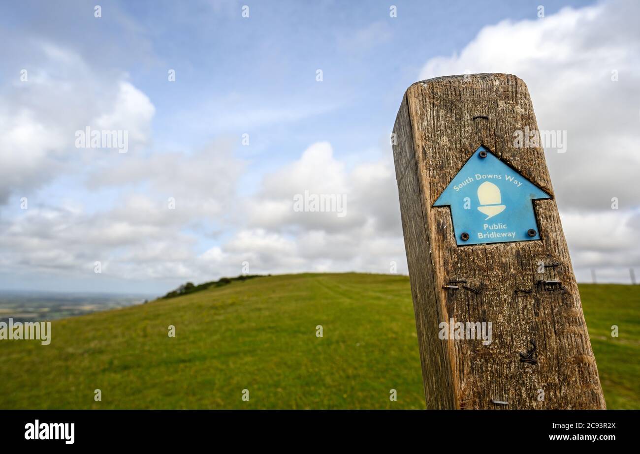 South Downs National Park, Sussex, UK near Firle Beacon. A signpost shows the route of the South Downs Way towards Firle Beacon. Stock Photo