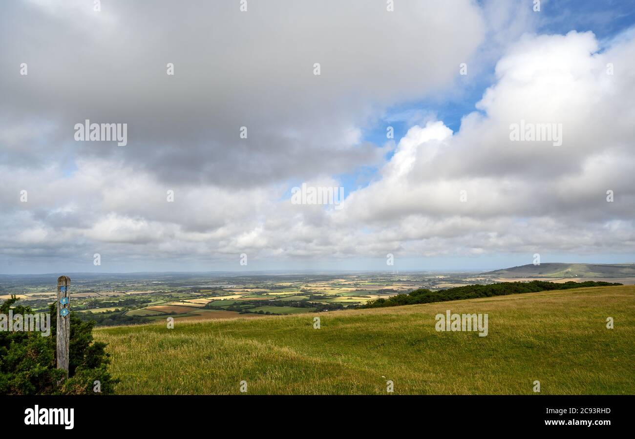 South Downs National Park, Sussex, UK near Firle Beacon. Signpost and views over the Weald seen from the South Downs Way. Stock Photo