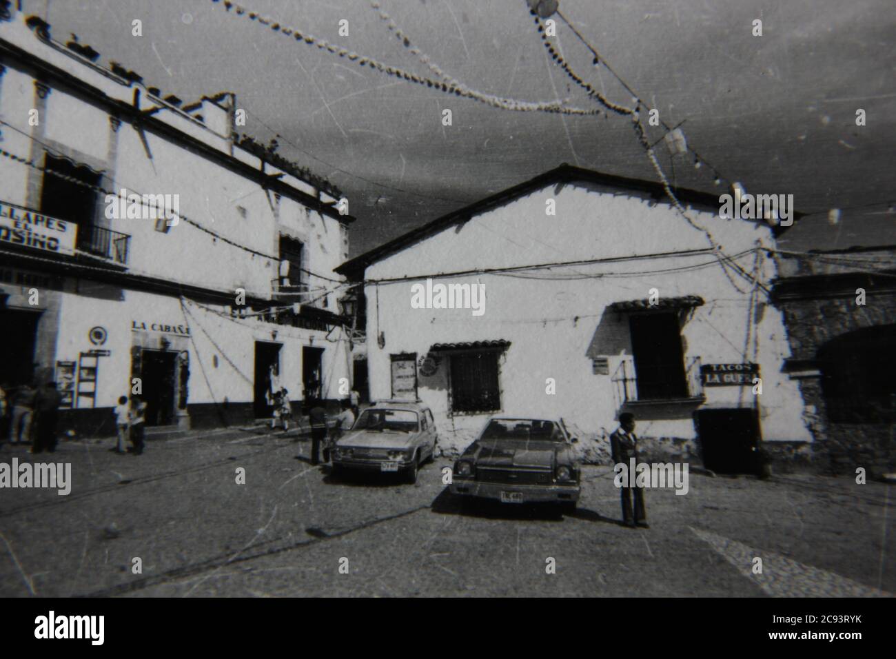 Fine 70s vintage black and white street photography of cars parked in