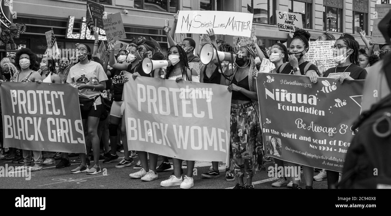 Black Womens/Womxn March Black Lives Matter - Protect Black Women and Girls Banner at Times Square Protest Stock Photo