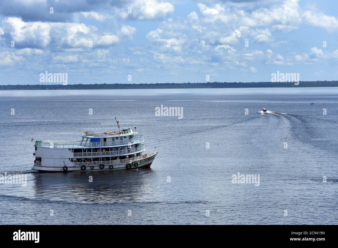 A riverboat leaving the port of Tefé on the Upper Amazon in Brazil Stock Photo
