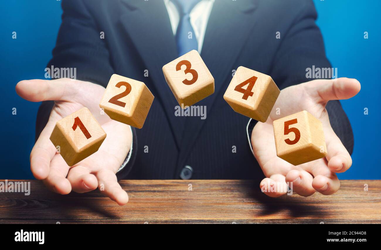 Man throws 5 numbered blocks with the numbers one two three four five