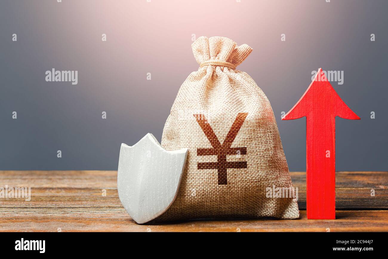 Yen Yuan sterling money bag with a shield and a red arrow up. Safety of investments, savings. Increasing the maximum amount of guaranteed insurance co Stock Photo