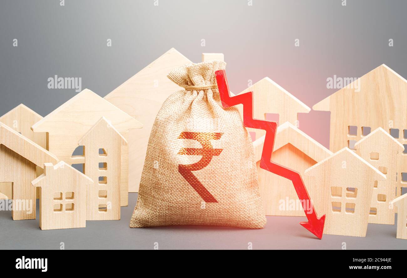 City residential buildings and indian rupee money bag with a red down