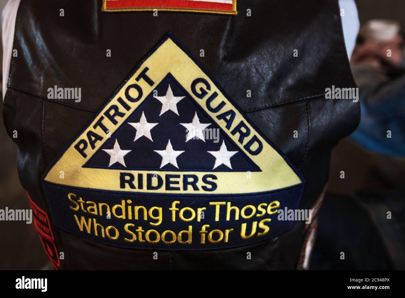 A veteran is seen wearing a Patriot Guard Riders Vest. Founded in 2005, members of the Patriot Guard Riders attend the funerals of members of the U.S. Stock Photo