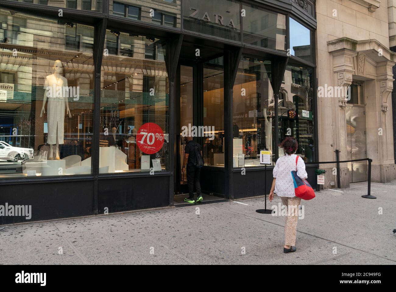 New York, United States. 28th July, 2020. Customer enters Zara store on 5th  Avenue, Manhattan. Inditex, owner of brand plans to close more than 1000  stores around the world. Company announced that